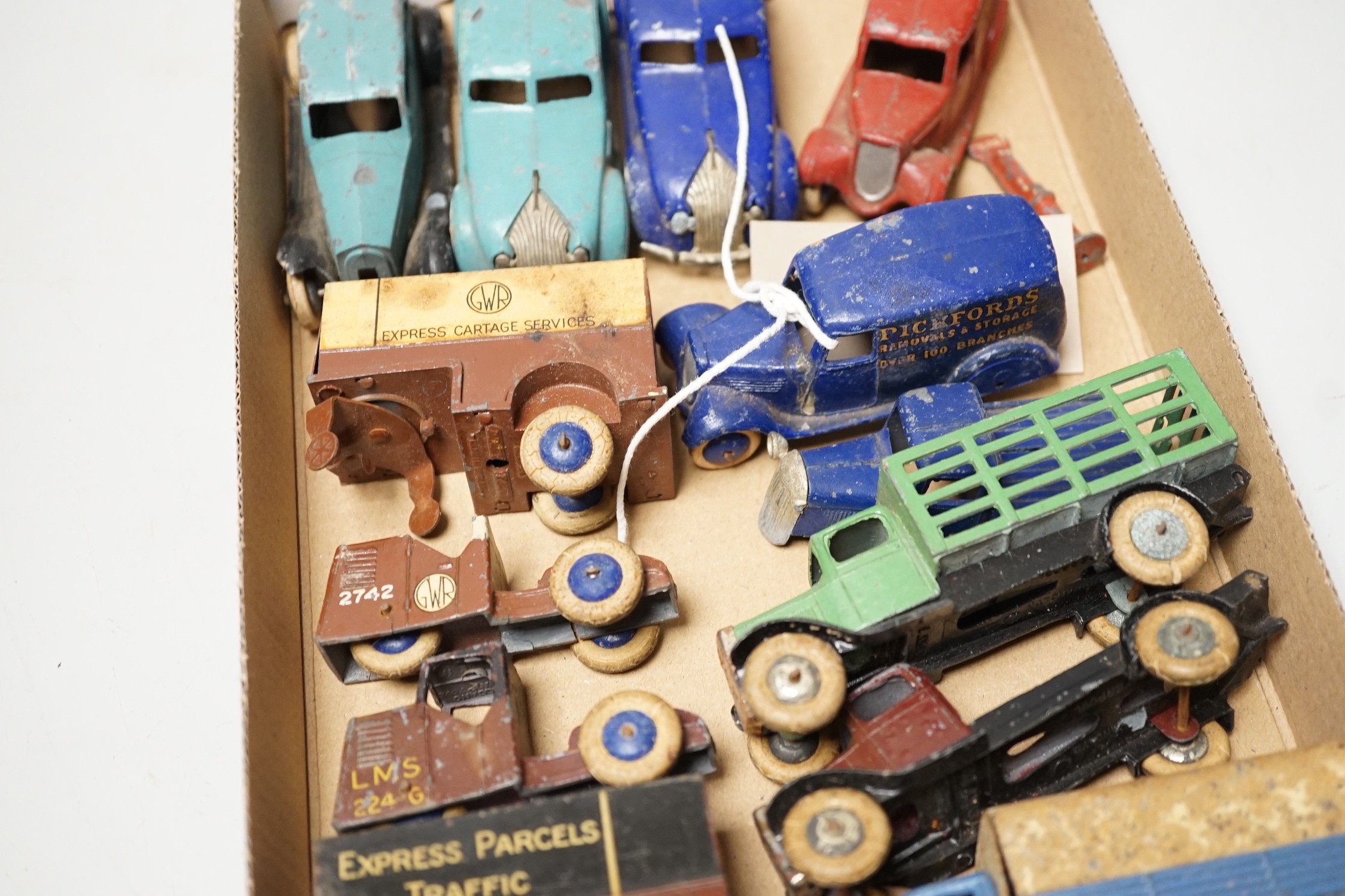 Rare pre-war Dinky toys including two 28-series, second-type delivery vans, Pickfords and Manchester Guardian